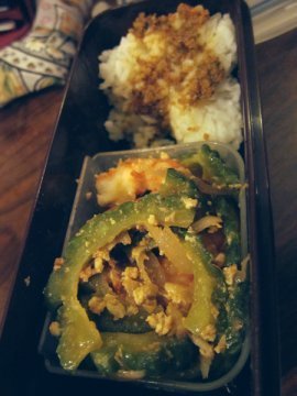 Bitter gourd and shrimp with some rice topped with tomato pesto
